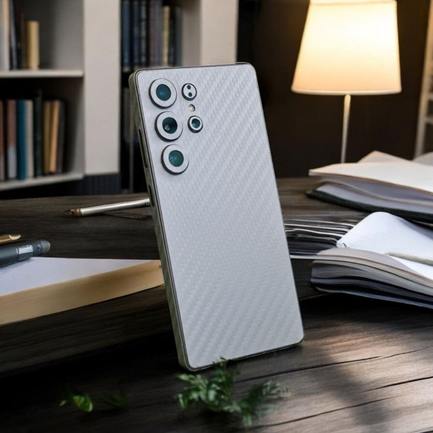 Smartphone with White Carbon Fiber mobile skin on a dark surface